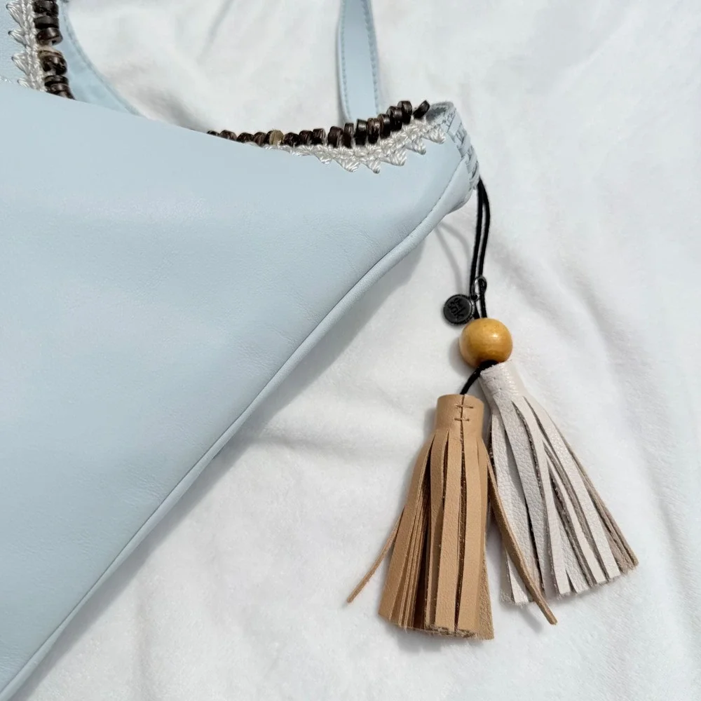 The Sak Huntley Chambray Blue Pebbled Leather Hobo Crossbody Bag Tassel Boho